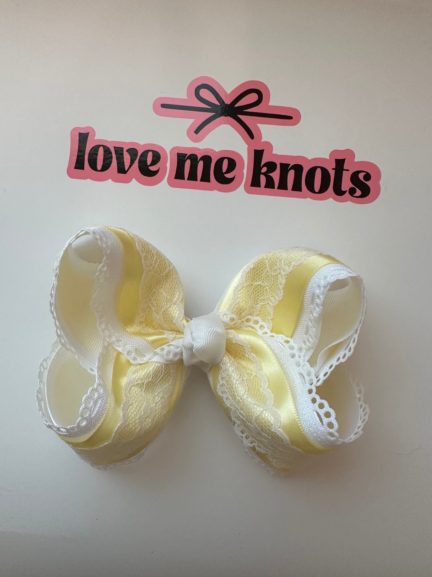 Yellow satin bow with lace