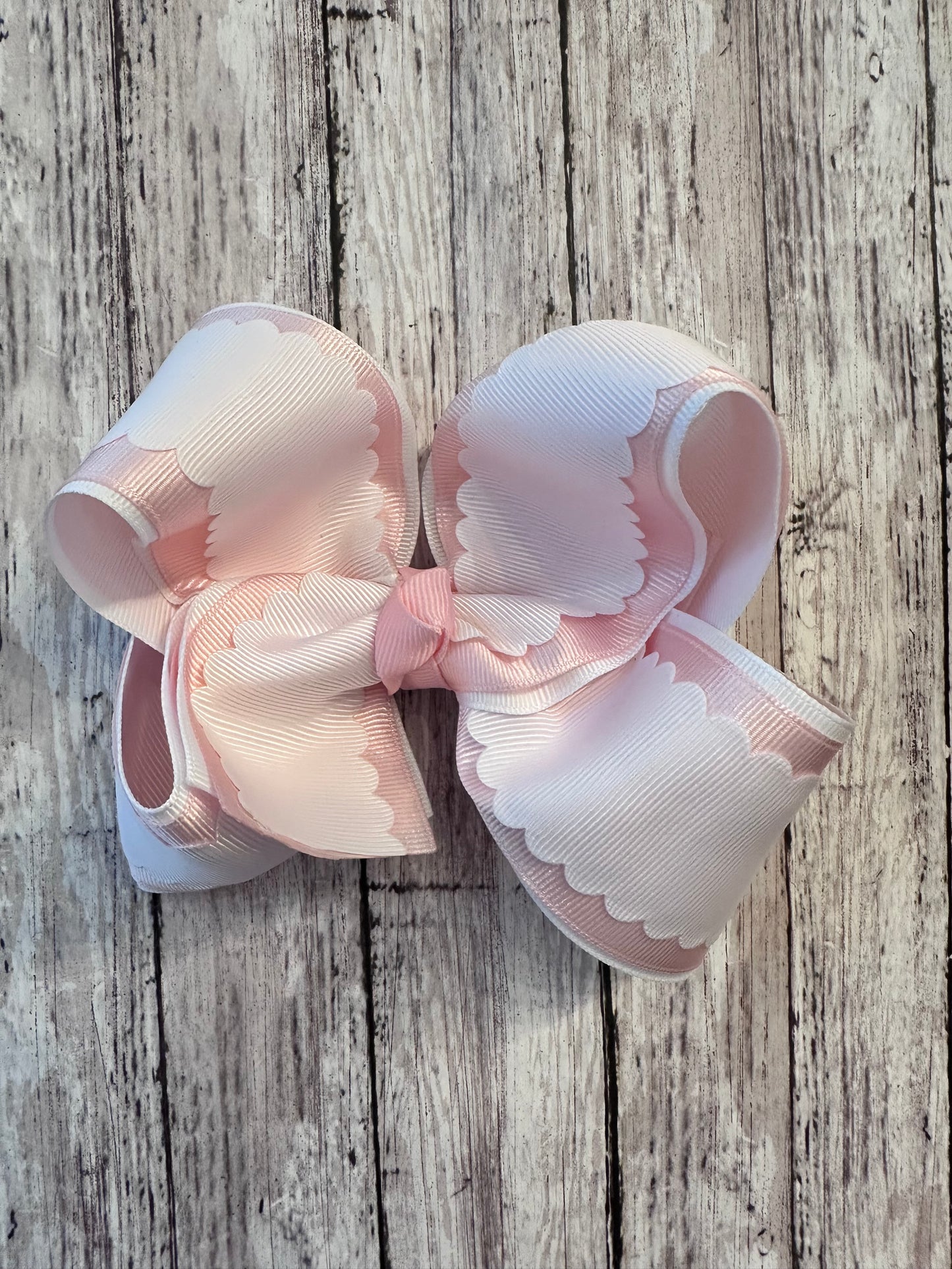 Light pink and white scallop bow