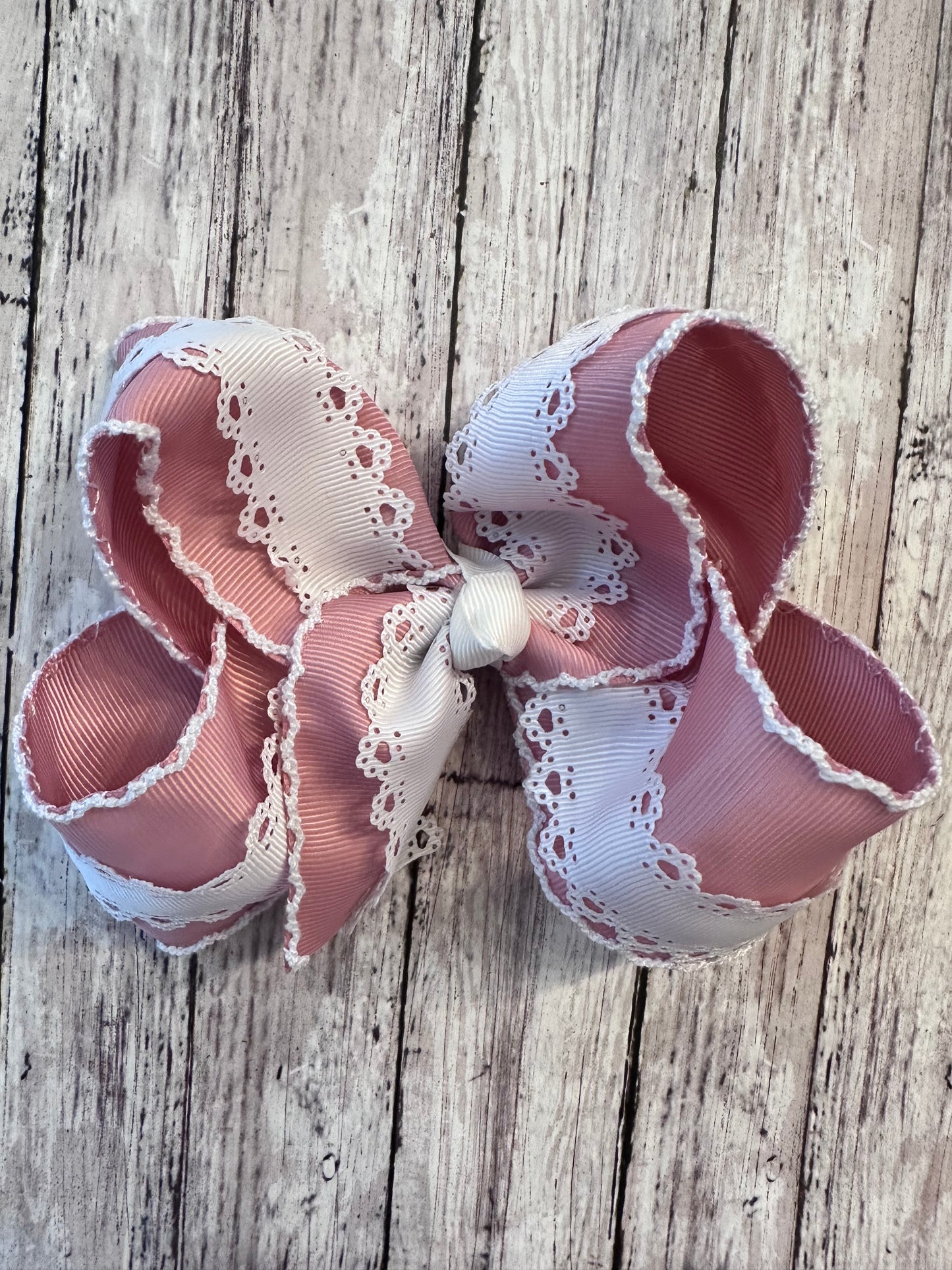 Mauve moonstitch bow with white lace