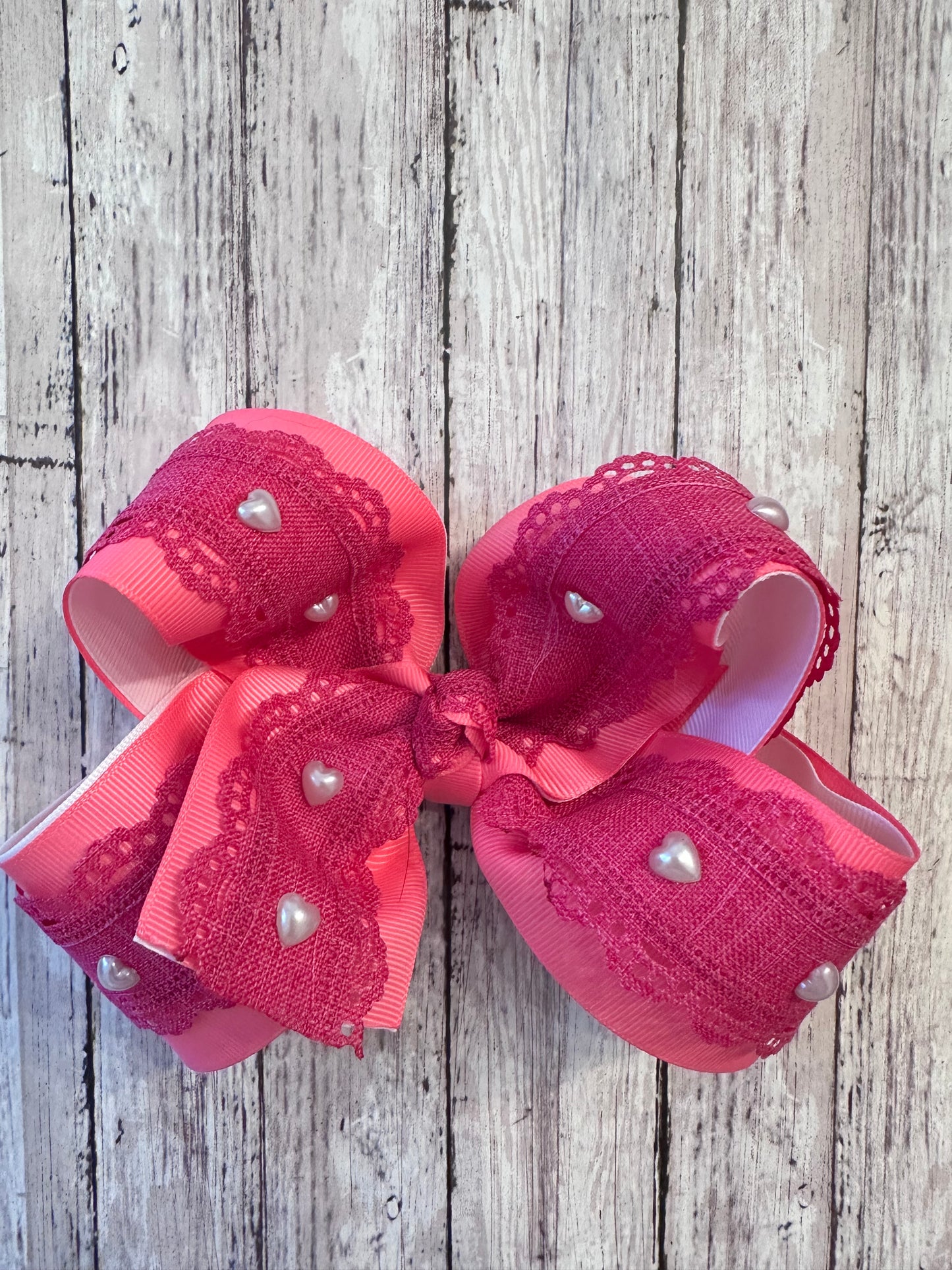 Pink pearl heart bow